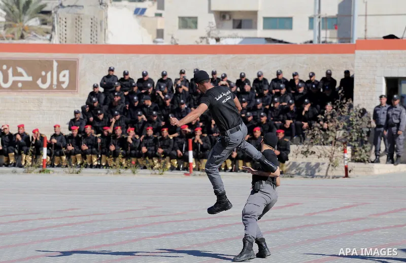 Palestinian members of officers display their skills during a graduation ceremony, in Gaza city on January 17, 2016. Photo by Mohammed Asad