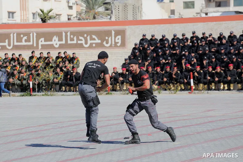 Palestinian members of officers display their skills during a graduation ceremony, in Gaza city on January 17, 2016. Photo by Mohammed Asad