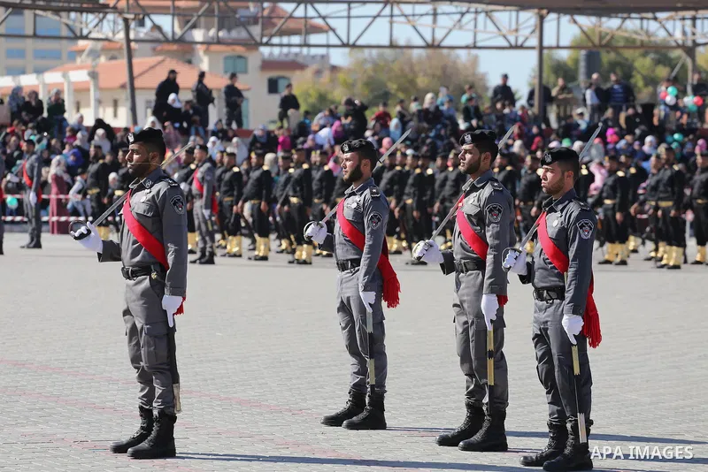 Palestinian members of officers display their skills during a graduation ceremony, in Gaza city on January 17, 2016. Photo by Mohammed Asad