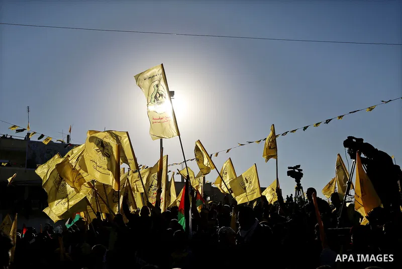 Palestinian Fatah supporters celebrate during a rally as they mark the 51st anniversary of the founding of the Fatah movement, in Beit Lahia in the northern Gaza Strip, on Jan. 17, 2016. Photo by Nidal Alwaheidi