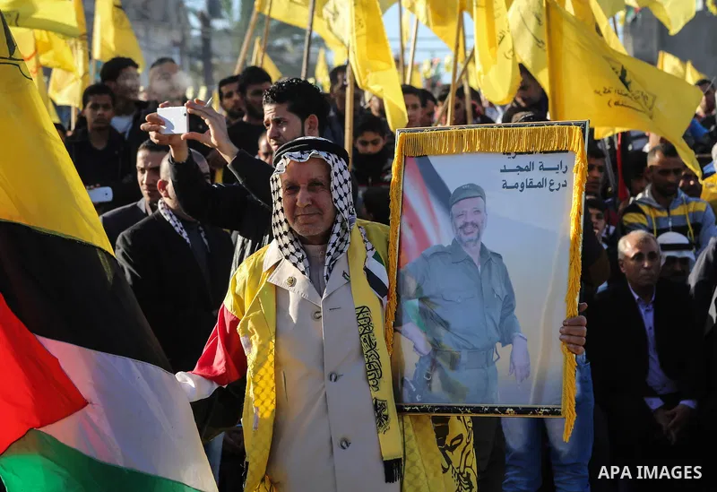 Palestinian Fatah supporters celebrate during a rally as they mark the 51st anniversary of the founding of the Fatah movement, in Beit Lahia in the northern Gaza Strip, on Jan. 17, 2016. Photo by Nidal Alwaheidi