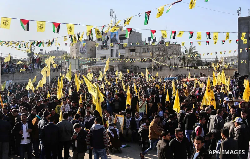 Palestinian Fatah supporters celebrate during a rally as they mark the 51st anniversary of the founding of the Fatah movement, in Beit Lahia in the northern Gaza Strip, on Jan. 17, 2016. Photo by Nidal Alwaheidi