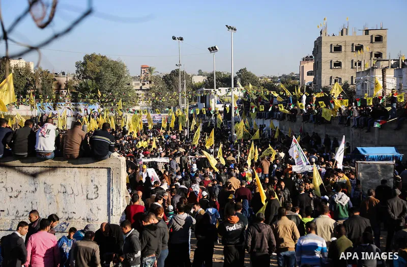 Palestinian Fatah supporters celebrate during a rally as they mark the 51st anniversary of the founding of the Fatah movement, in Beit Lahia in the northern Gaza Strip, on Jan. 17, 2016. Photo by Nidal Alwaheidi