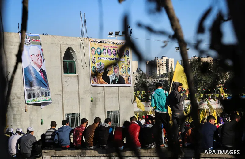 Palestinian Fatah supporters celebrate during a rally as they mark the 51st anniversary of the founding of the Fatah movement, in Beit Lahia in the northern Gaza Strip, on Jan. 17, 2016. Photo by Nidal Alwaheidi