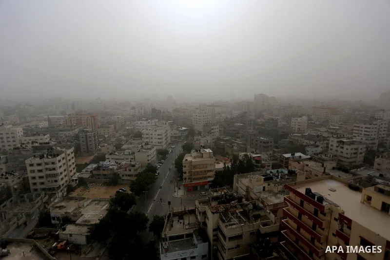 A sandstorm is seen over Gaza city on January 18, 2016. Photo by Yasser Qudih
