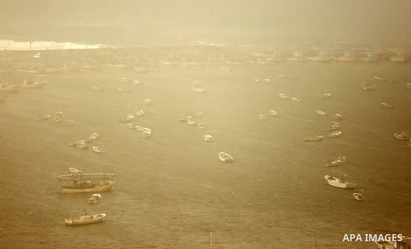 Fishing boats are seen at the Gaza port during a heavy storm on January 18, 2016. Photo by Yasser Qudih
