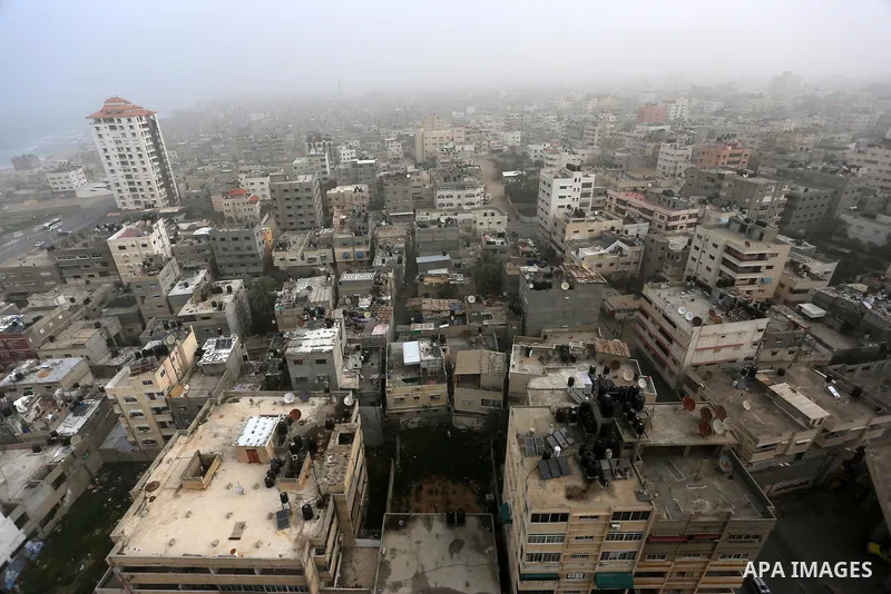 A sandstorm is seen over Gaza city on January 18, 2016. Photo by Yasser Qudih