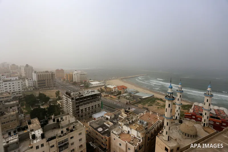A sandstorm is seen over Gaza city on January 18, 2016. Photo by Yasser Qudih