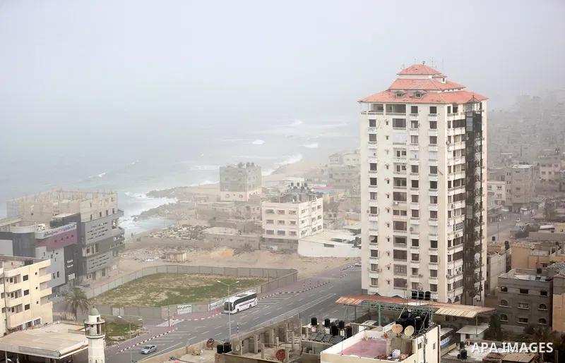 A sandstorm is seen over Gaza city on January 18, 2016. Photo by Yasser Qudih