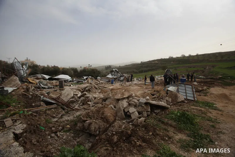 Palestinians inspect the rubble of a farm that was demolished after Israeli authorities said it was built without a permit on January 18, 2016 in the West Bank village al-Fundoq east of the village of Qalqiliya. Photo by...