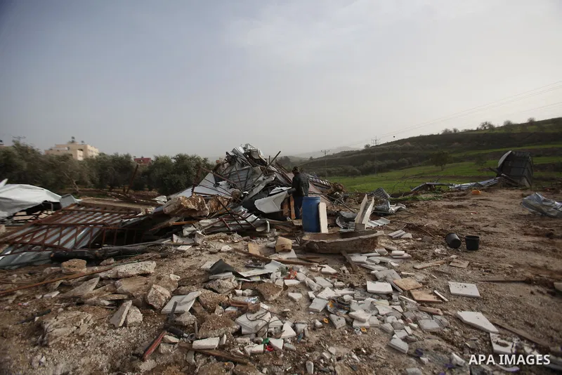 Palestinians inspect the rubble of a farm that was demolished after Israeli authorities said it was built without a permit on January 18, 2016 in the West Bank village al-Fundoq east of the village of Qalqiliya. Photo by...