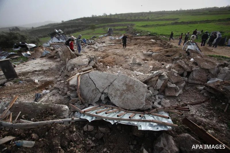 Palestinians inspect the rubble of a farm that was demolished after Israeli authorities said it was built without a permit on January 18, 2016 in the West Bank village al-Fundoq east of the village of Qalqiliya. Photo by...