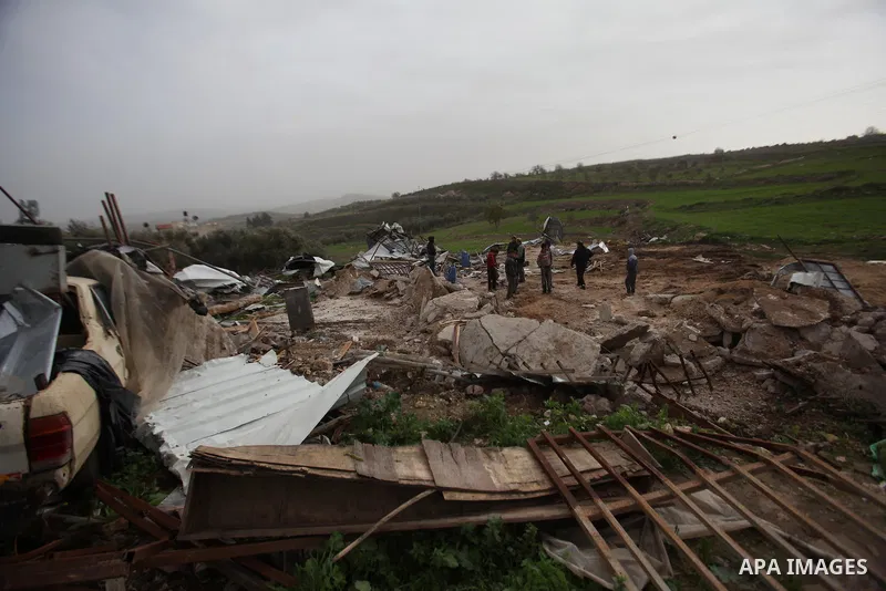 Palestinians inspect the rubble of a farm that was demolished after Israeli authorities said it was built without a permit on January 18, 2016 in the West Bank village al-Fundoq east of the village of Qalqiliya. Photo by...