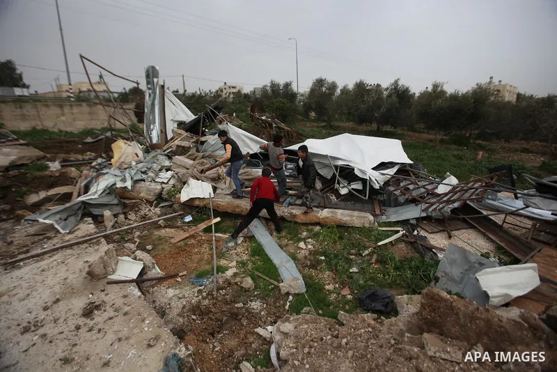 Palestinians inspect the rubble of a farm that was demolished after Israeli authorities said it was built without a permit on January 18, 2016 in the West Bank village al-Fundoq east of the village of Qalqiliya. Photo by...