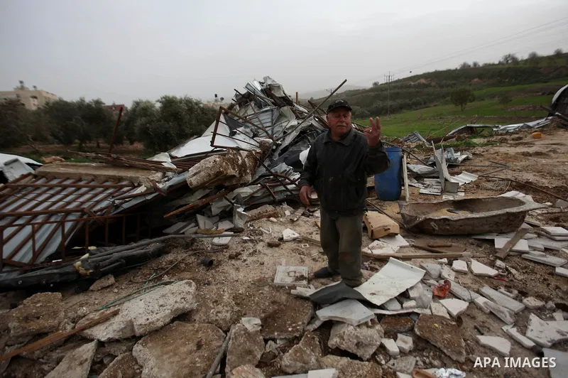 Palestinians inspect the rubble of a farm that was demolished after Israeli authorities said it was built without a permit on January 18, 2016 in the West Bank village al-Fundoq east of the village of Qalqiliya. Photo by...
