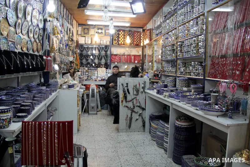 A Palestinian vendor displays goods at market in Jerusalem's old city on Jan. 18, 2016. Photo by Mahfouz Abu Turk