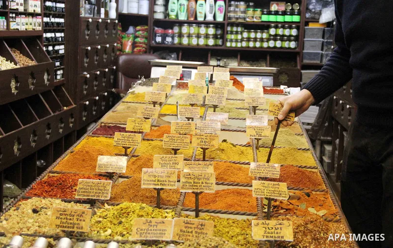 A Palestinian vendor displays goods at market in Jerusalem's old city on Jan. 18, 2016. Photo by Mahfouz Abu Turk