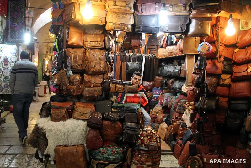 A Palestinian vendor displays goods at market in Jerusalem's old city on Jan. 18, 2016. Photo by Mahfouz Abu Turk