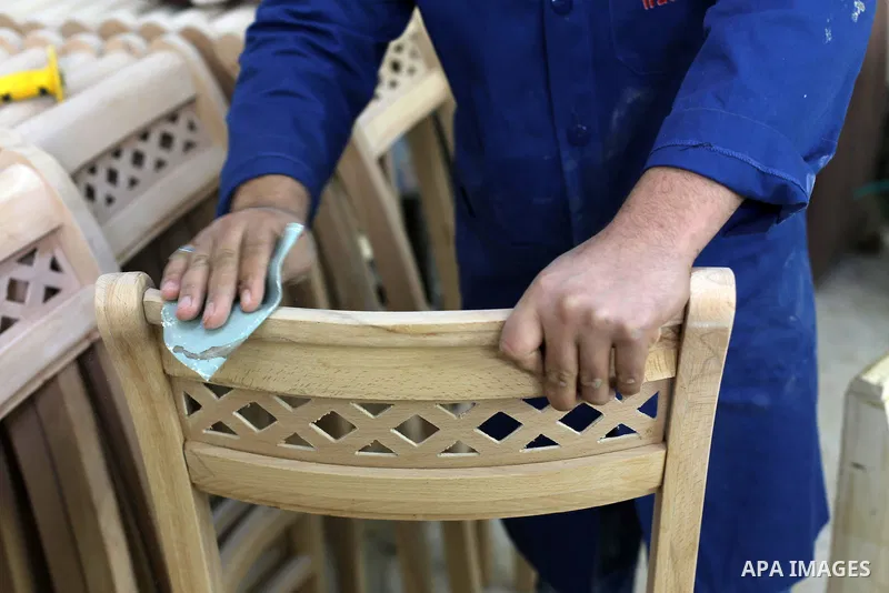 A Palestinian disabled works on wood to makes furniture during participate in a project titled "Erada" funded by the Turkish President Ragab Ardogan at the Islamic university, in Gaza City, on January 20, 2016. Photo by...