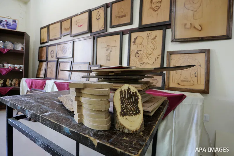 A picture shows wood products which made by Palestinians disabled during a project titled "Erada" funded by the Turkish President Ragab Ardogan at the Islamic university, in Gaza City, on January 20, 2016. Photo by Moham...