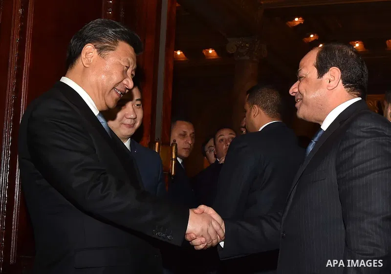 Egyptian President Abdel Fattah al-Sisi greets Chinese President Xi Jinping upon his arrival in Cairo, Egypt, January 20, 2016. Xi Jinping arrived in Cairo Wednesday for a state visit to Egypt, the second leg of his thre...