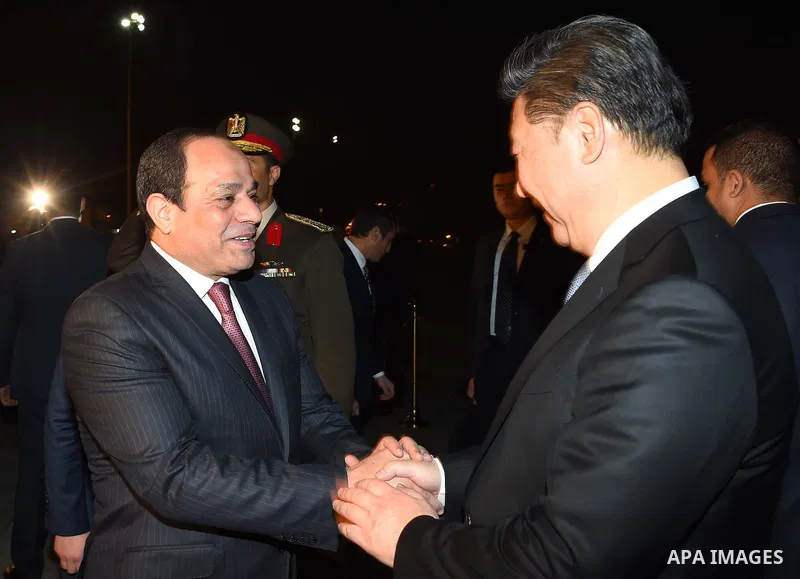 Egyptian President Abdel Fattah al-Sisi greets Chinese President Xi Jinping upon his arrival in Cairo, Egypt, January 20, 2016. Xi Jinping arrived in Cairo Wednesday for a state visit to Egypt, the second leg of his thre...