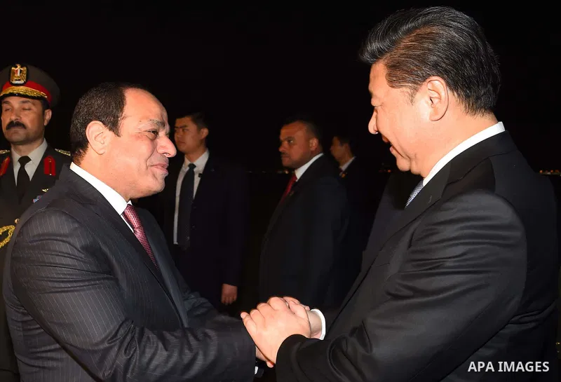 Egyptian President Abdel Fattah al-Sisi greets Chinese President Xi Jinping upon his arrival in Cairo, Egypt, January 20, 2016. Xi Jinping arrived in Cairo Wednesday for a state visit to Egypt, the second leg of his thre...