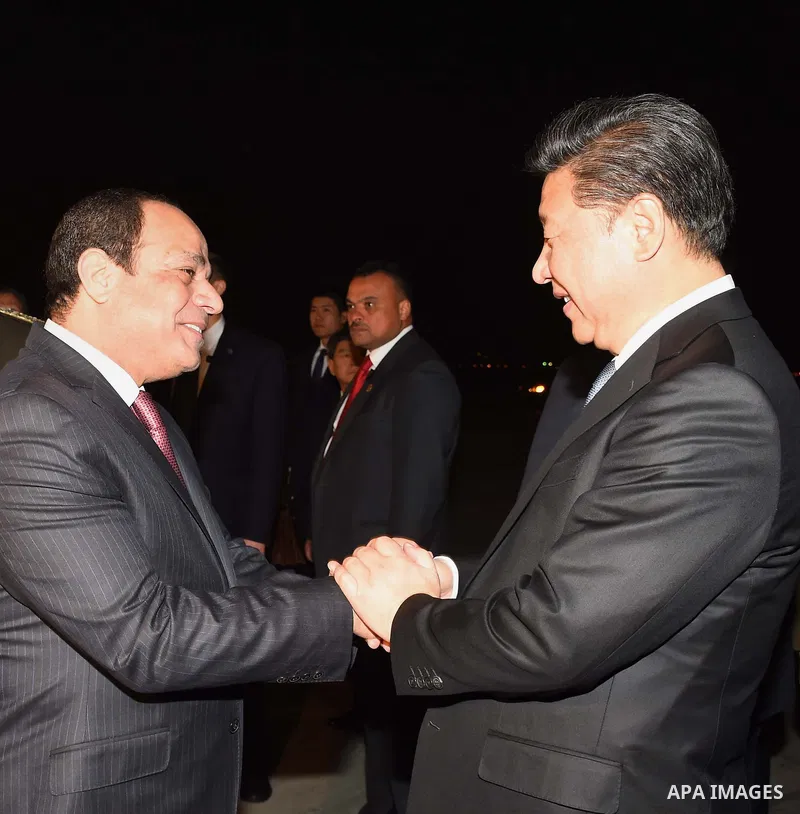Egyptian President Abdel Fattah al-Sisi greets Chinese President Xi Jinping upon his arrival in Cairo, Egypt, January 20, 2016. Xi Jinping arrived in Cairo Wednesday for a state visit to Egypt, the second leg of his thre...