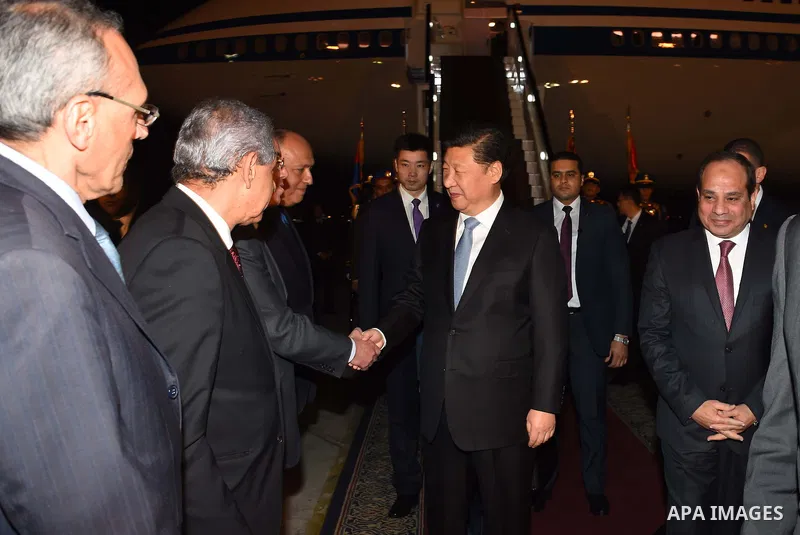 Egyptian President Abdel Fattah al-Sisi greets Chinese President Xi Jinping upon his arrival in Cairo, Egypt, January 20, 2016. Xi Jinping arrived in Cairo Wednesday for a state visit to Egypt, the second leg of his thre...