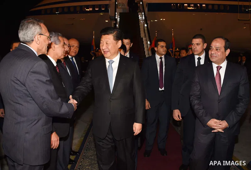 Egyptian President Abdel Fattah al-Sisi greets Chinese President Xi Jinping upon his arrival in Cairo, Egypt, January 20, 2016. Xi Jinping arrived in Cairo Wednesday for a state visit to Egypt, the second leg of his thre...