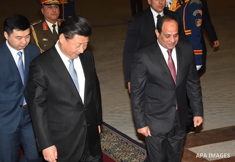 Egyptian President Abdel Fattah al-Sisi greets Chinese President Xi Jinping upon his arrival in Cairo, Egypt, January 20, 2016. Xi Jinping arrived in Cairo Wednesday for a state visit to Egypt, the second leg of his thre...