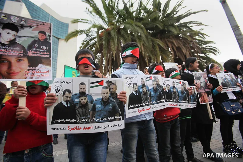 Palestinians take part in a demonstration demanding the release of a 13-year-old Ahmed Manasra, from Israeli jails, in the West Bank city of Nablus on Jan. 21, 2016. Israeli police have accused Manasra, together with his...