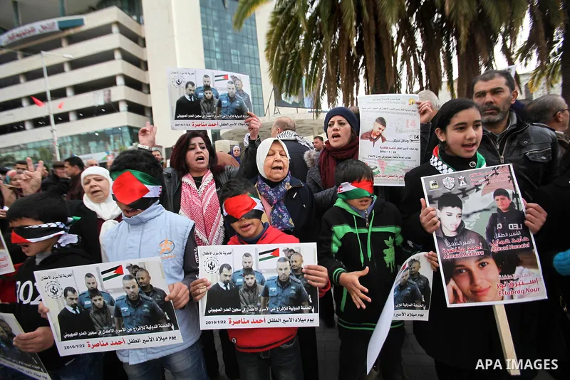 Palestinians take part in a demonstration demanding the release of a 13-year-old Ahmed Manasra, from Israeli jails, in the West Bank city of Nablus on Jan. 21, 2016. Israeli police have accused Manasra, together with his...