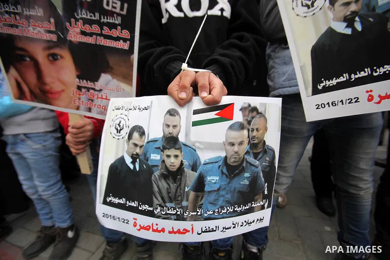 Palestinians take part in a demonstration demanding the release of a 13-year-old Ahmed Manasra, from Israeli jails, in the West Bank city of Nablus on Jan. 21, 2016. Israeli police have accused Manasra, together with his...