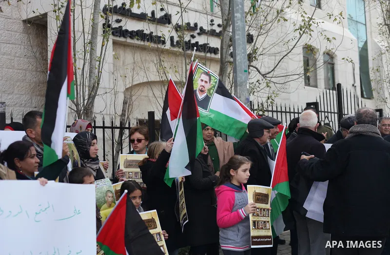 Palestinians take part in a demonstration demanding Israeli authorities to return the bodies of alleged Palestinian attackers in the West Bank city of Ramallah on Jan. 21, 2016. Photo by Shadi Hatem