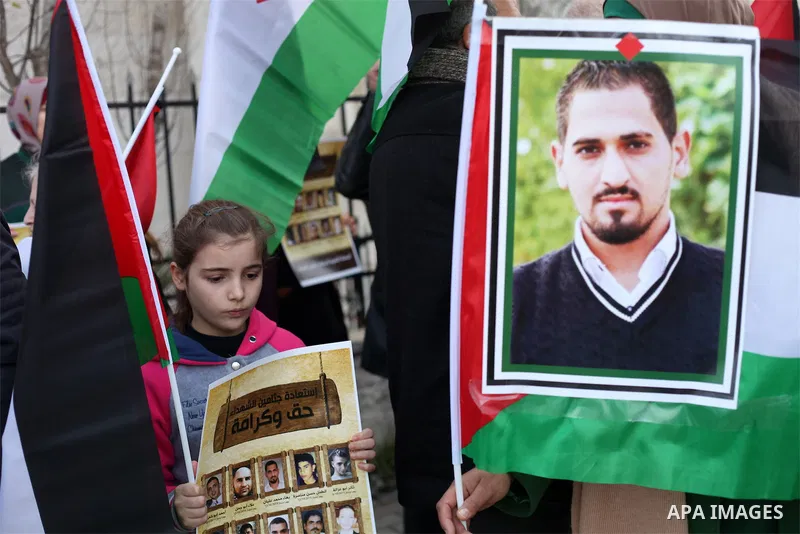Palestinians take part in a demonstration demanding Israeli authorities to return the bodies of alleged Palestinian attackers in the West Bank city of Ramallah on Jan. 21, 2016. Photo by Shadi Hatem