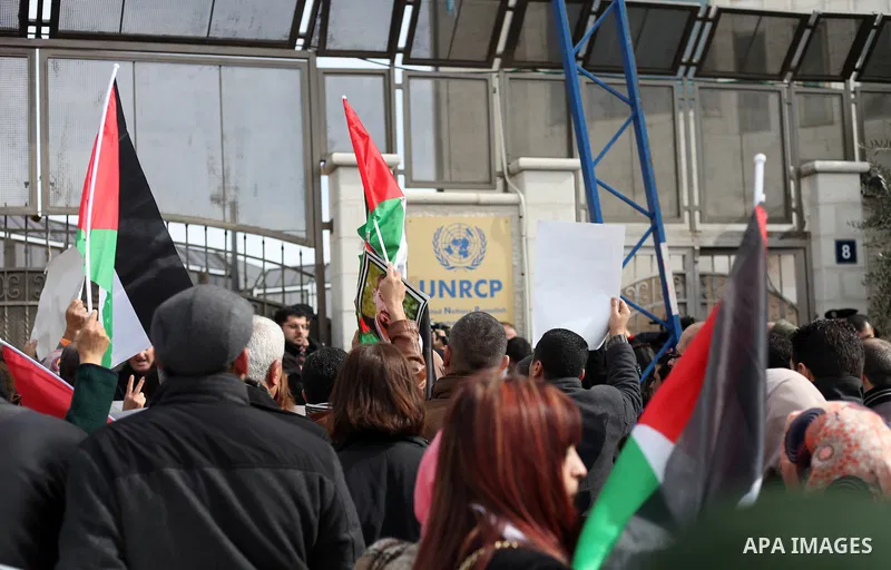 Palestinians take part in a demonstration demanding Israeli authorities to return the bodies of alleged Palestinian attackers in the West Bank city of Ramallah on Jan. 21, 2016. Photo by Shadi Hatem