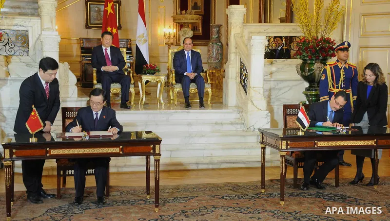 Egypt's President Abdel Fattah al-Sisi and China's President Xi Jinping attend the signature of trade deals in the Egyptian capital Cairo on Jan. 21, 2016. Jinping signed a slew of trade deals with Egypt's leader as part...