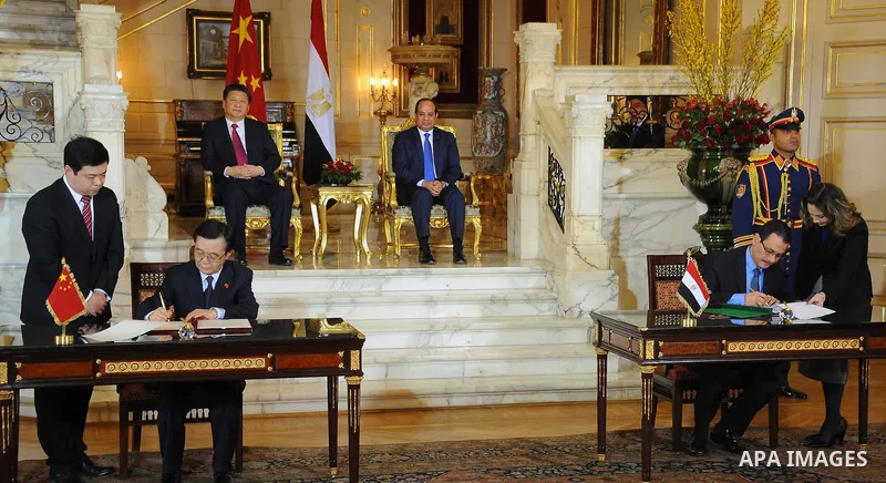 Egypt's President Abdel Fattah al-Sisi and China's President Xi Jinping attend the signature of trade deals in the Egyptian capital Cairo on Jan. 21, 2016. Jinping signed a slew of trade deals with Egypt's leader as part...