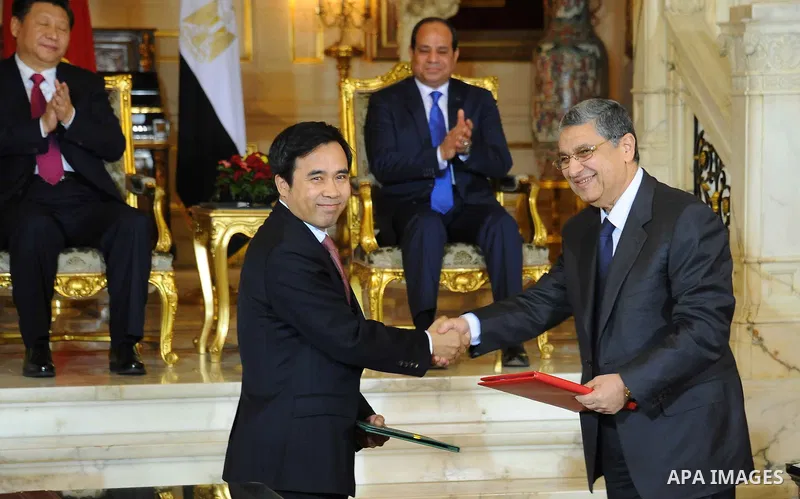 Egypt's President Abdel Fattah al-Sisi and China's President Xi Jinping attend the signature of trade deals in the Egyptian capital Cairo on Jan. 21, 2016. Jinping signed a slew of trade deals with Egypt's leader as part...