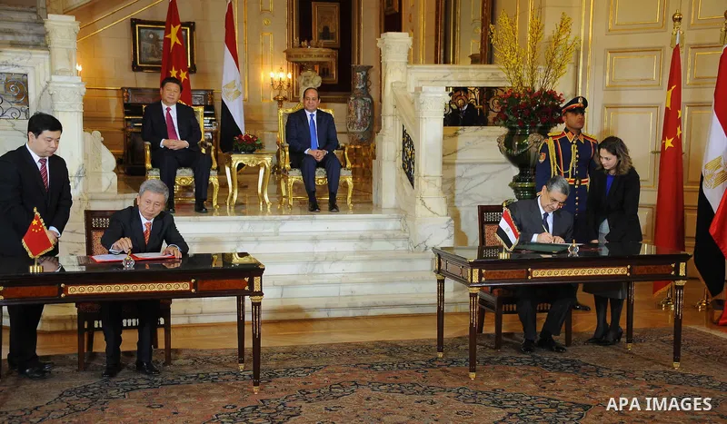 Egypt's President Abdel Fattah al-Sisi and China's President Xi Jinping attend the signature of trade deals in the Egyptian capital Cairo on Jan. 21, 2016. Jinping signed a slew of trade deals with Egypt's leader as part...