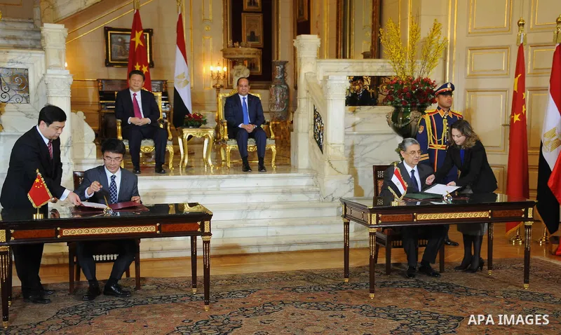 Egypt's President Abdel Fattah al-Sisi and China's President Xi Jinping attend the signature of trade deals in the Egyptian capital Cairo on Jan. 21, 2016. Jinping signed a slew of trade deals with Egypt's leader as part...