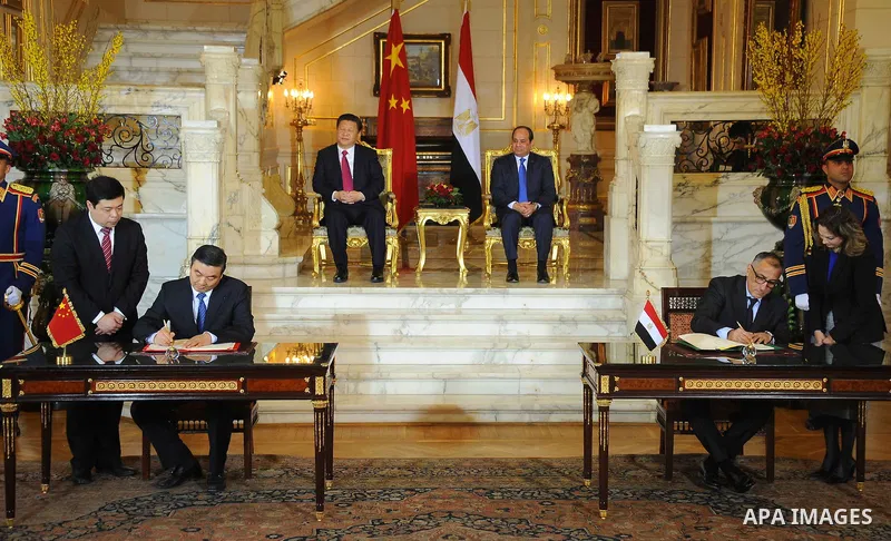 Egypt's President Abdel Fattah al-Sisi and China's President Xi Jinping attend the signature of trade deals in the Egyptian capital Cairo on Jan. 21, 2016. Jinping signed a slew of trade deals with Egypt's leader as part...