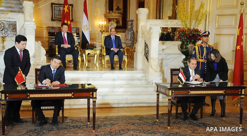 Egypt's President Abdel Fattah al-Sisi and China's President Xi Jinping attend the signature of trade deals in the Egyptian capital Cairo on Jan. 21, 2016. Jinping signed a slew of trade deals with Egypt's leader as part...
