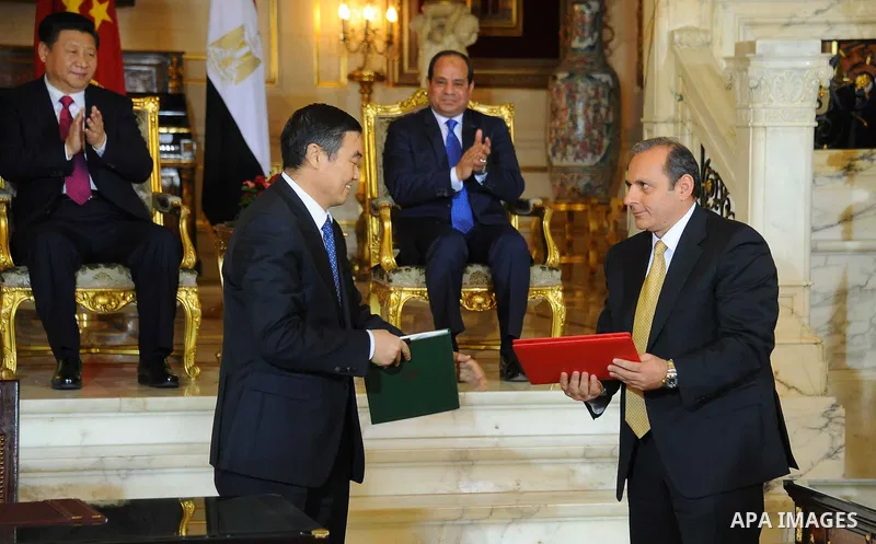 Egypt's President Abdel Fattah al-Sisi and China's President Xi Jinping attend the signature of trade deals in the Egyptian capital Cairo on Jan. 21, 2016. Jinping signed a slew of trade deals with Egypt's leader as part...