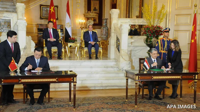 Egypt's President Abdel Fattah al-Sisi and China's President Xi Jinping attend the signature of trade deals in the Egyptian capital Cairo on Jan. 21, 2016. Jinping signed a slew of trade deals with Egypt's leader as part...