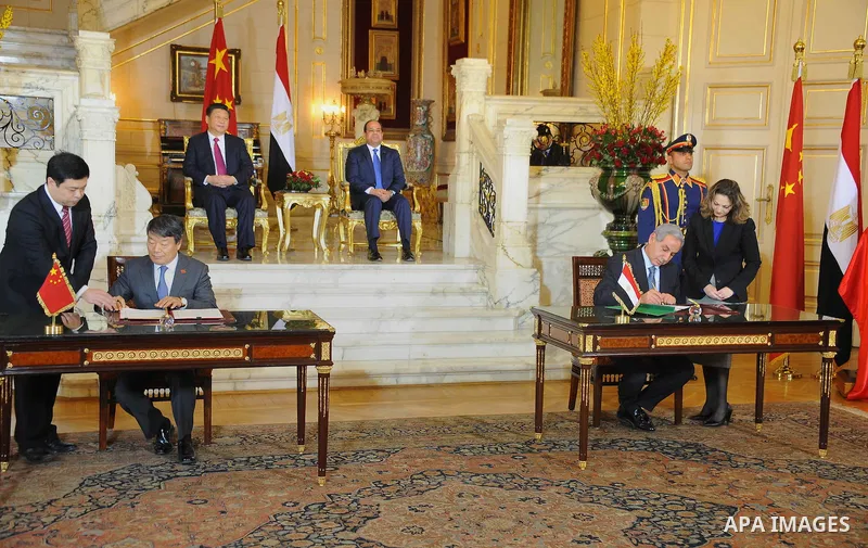 Egypt's President Abdel Fattah al-Sisi and China's President Xi Jinping attend the signature of trade deals in the Egyptian capital Cairo on Jan. 21, 2016. Jinping signed a slew of trade deals with Egypt's leader as part...
