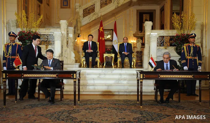 Egypt's President Abdel Fattah al-Sisi and China's President Xi Jinping attend the signature of trade deals in the Egyptian capital Cairo on Jan. 21, 2016. Jinping signed a slew of trade deals with Egypt's leader as part...