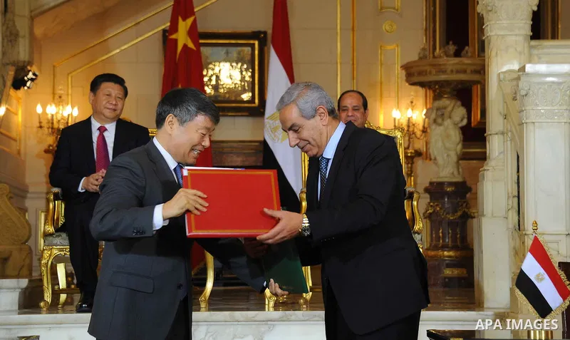 Egypt's President Abdel Fattah al-Sisi and China's President Xi Jinping attend the signature of trade deals in the Egyptian capital Cairo on Jan. 21, 2016. Jinping signed a slew of trade deals with Egypt's leader as part...