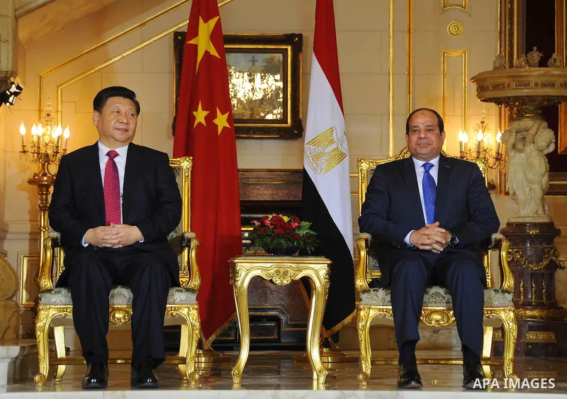 Egypt's President Abdel Fattah al-Sisi and China's President Xi Jinping attend the signature of trade deals in the Egyptian capital Cairo on Jan. 21, 2016. Jinping signed a slew of trade deals with Egypt's leader as part...